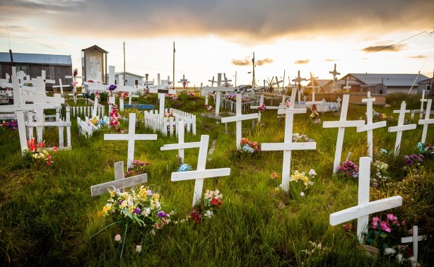 "Simple wooden crosses mark the grave sites at an indigenous cemetery in Chefornak." Photo by Loren Holmes for The Atlantic